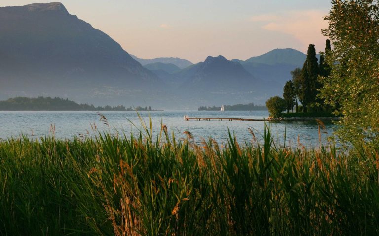 A calm mountain lake at golden hour, placeholder hero image