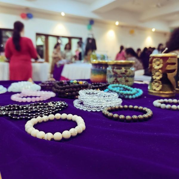 Close-up of crystal bead bracelets laid out for display