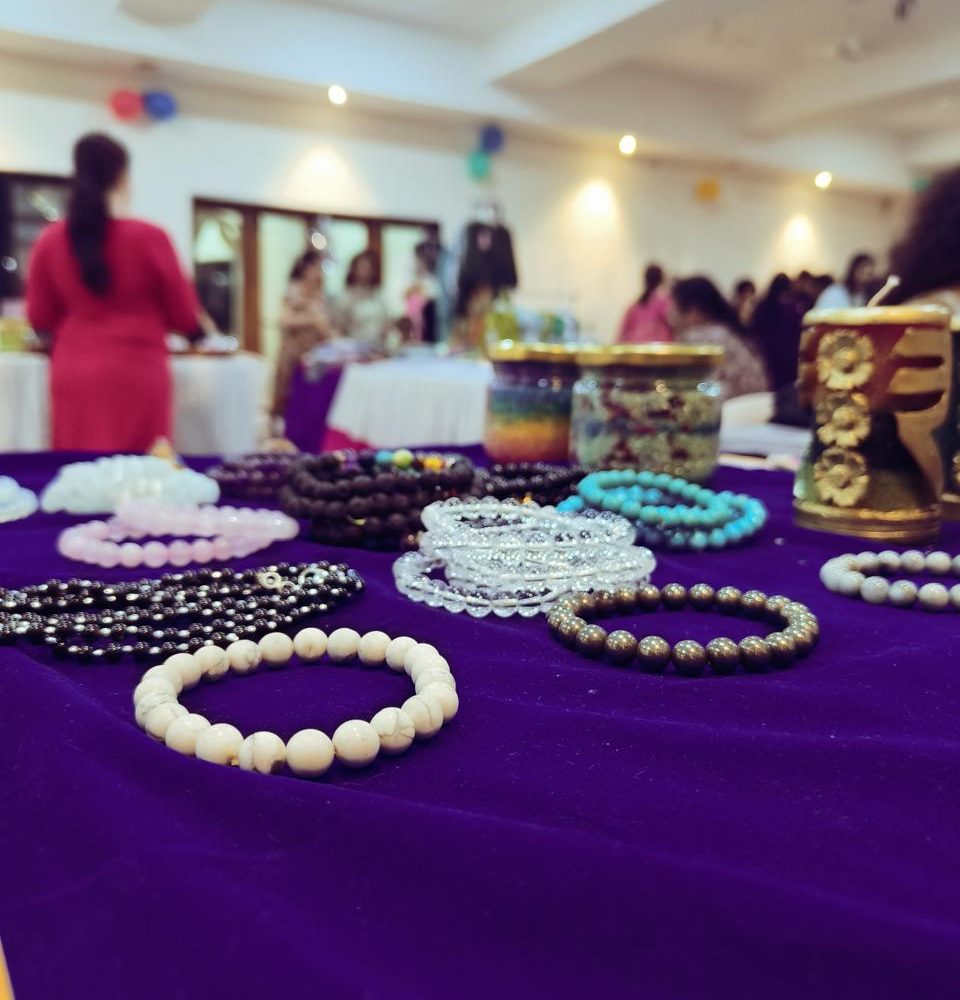 Close-up of crystal bead bracelets laid out for display
